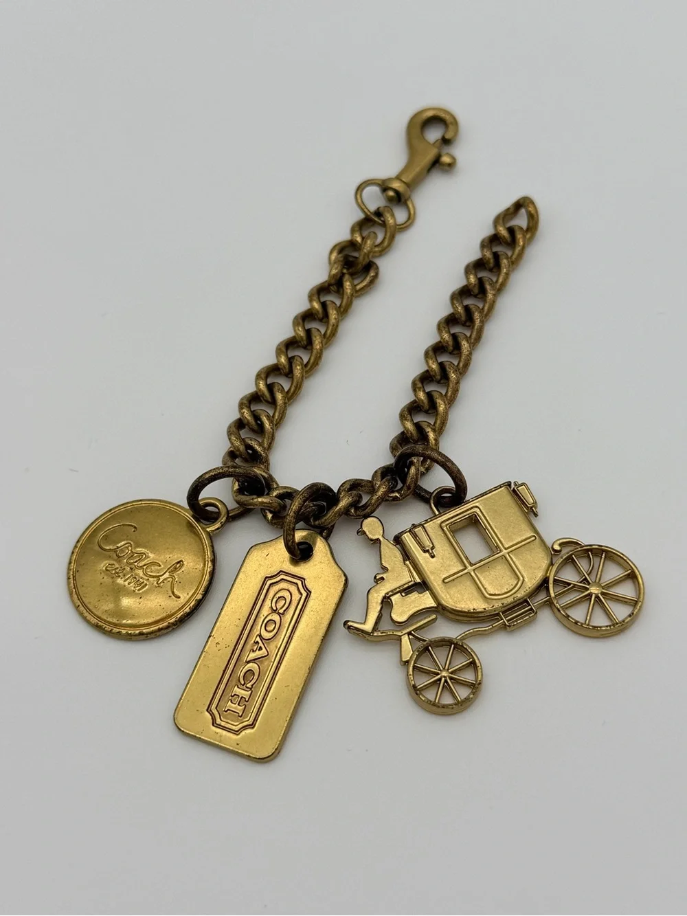 COACH Brass Charm Bracelet with Coach Tags & Horse Carriage Charm